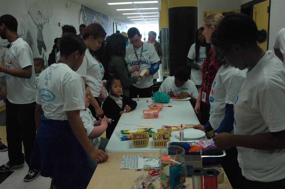 Buddies and participants enjoy a craft at last year's Special Olympics event. On March 7th, Central will once again host basketball and other games for area special needs students.