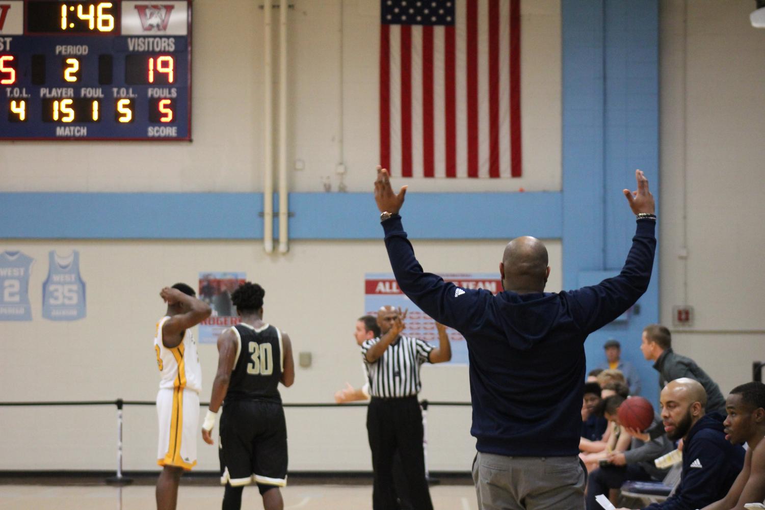 Coach Gilmore shows his displeasure at a call against the Hawks during the Ameritime Tournament. The Hawks would go on to win first place.