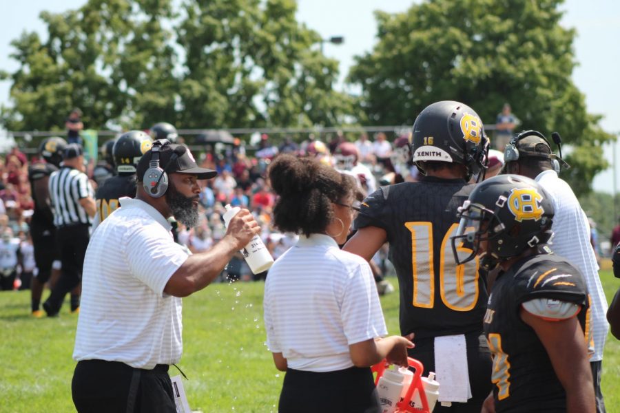 Coach Davis takes a water break during the Hawks opening game against eventual State Champion, DeSmet.