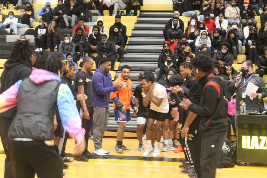 Students get hyped for the introduction of players for the Staff vs. Student basketball game. GPA requirements for incentive attendance can mean that some students wont get to experience these types of events.